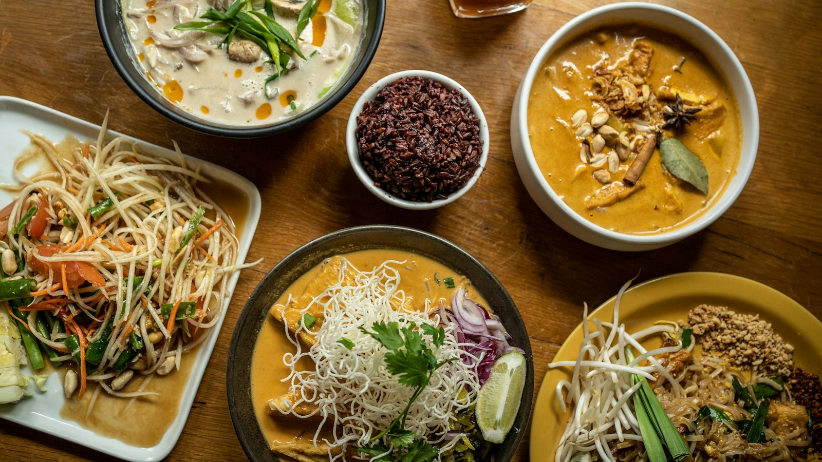 A table of Thai dishes seen from above